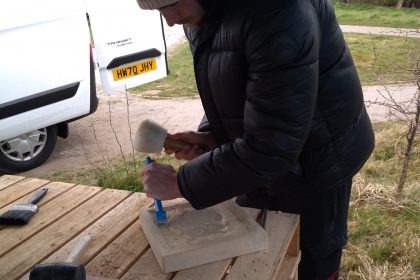 Alfie carving his owl
